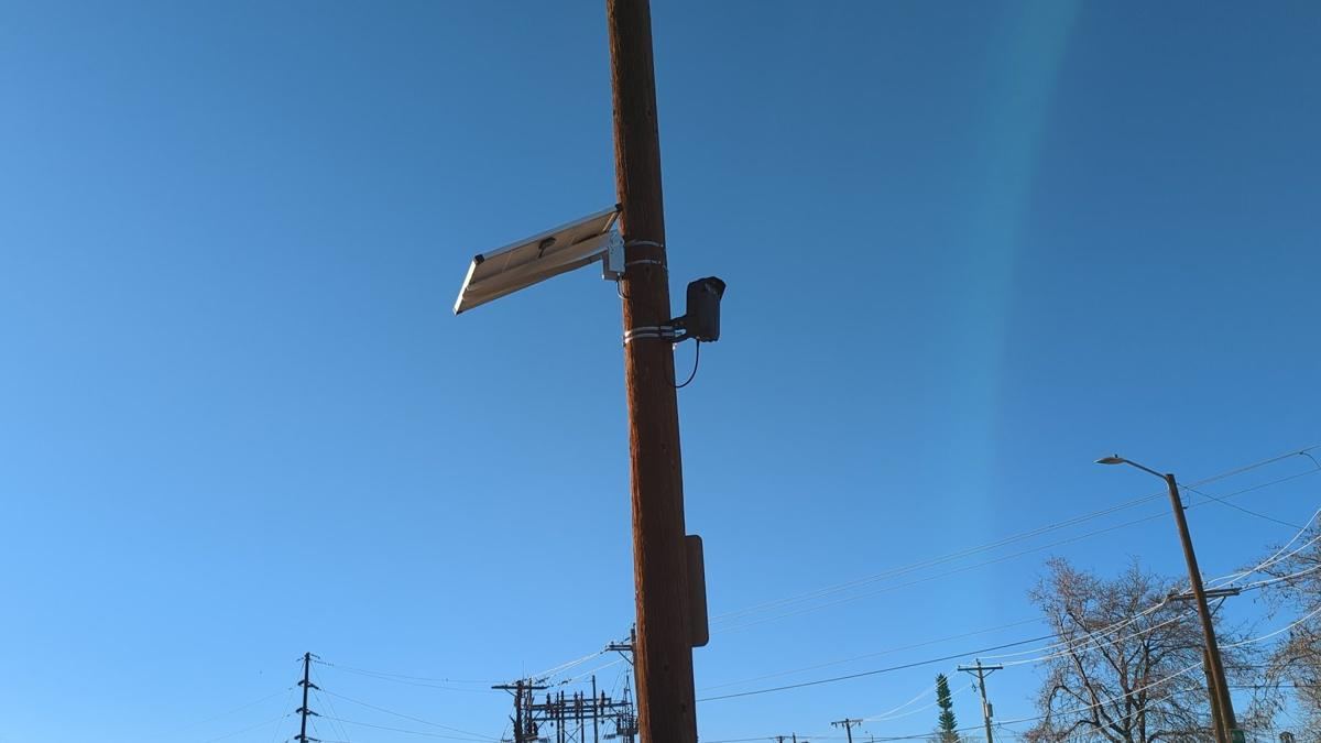 Pole with camera and panel from street level